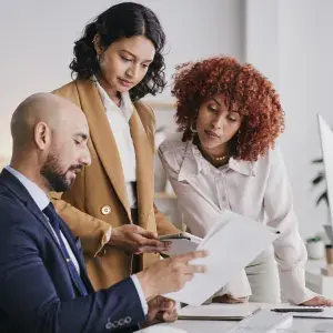 executive team looking at documents